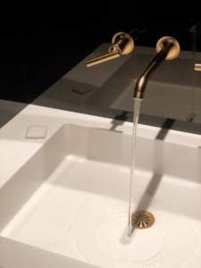 a faucet with flowing water.