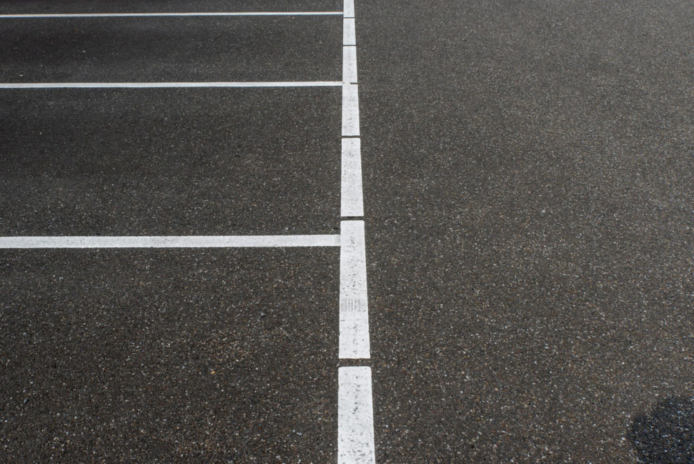 Smooth and well-maintained sidewalk with no cracks, suitable for safe walking.